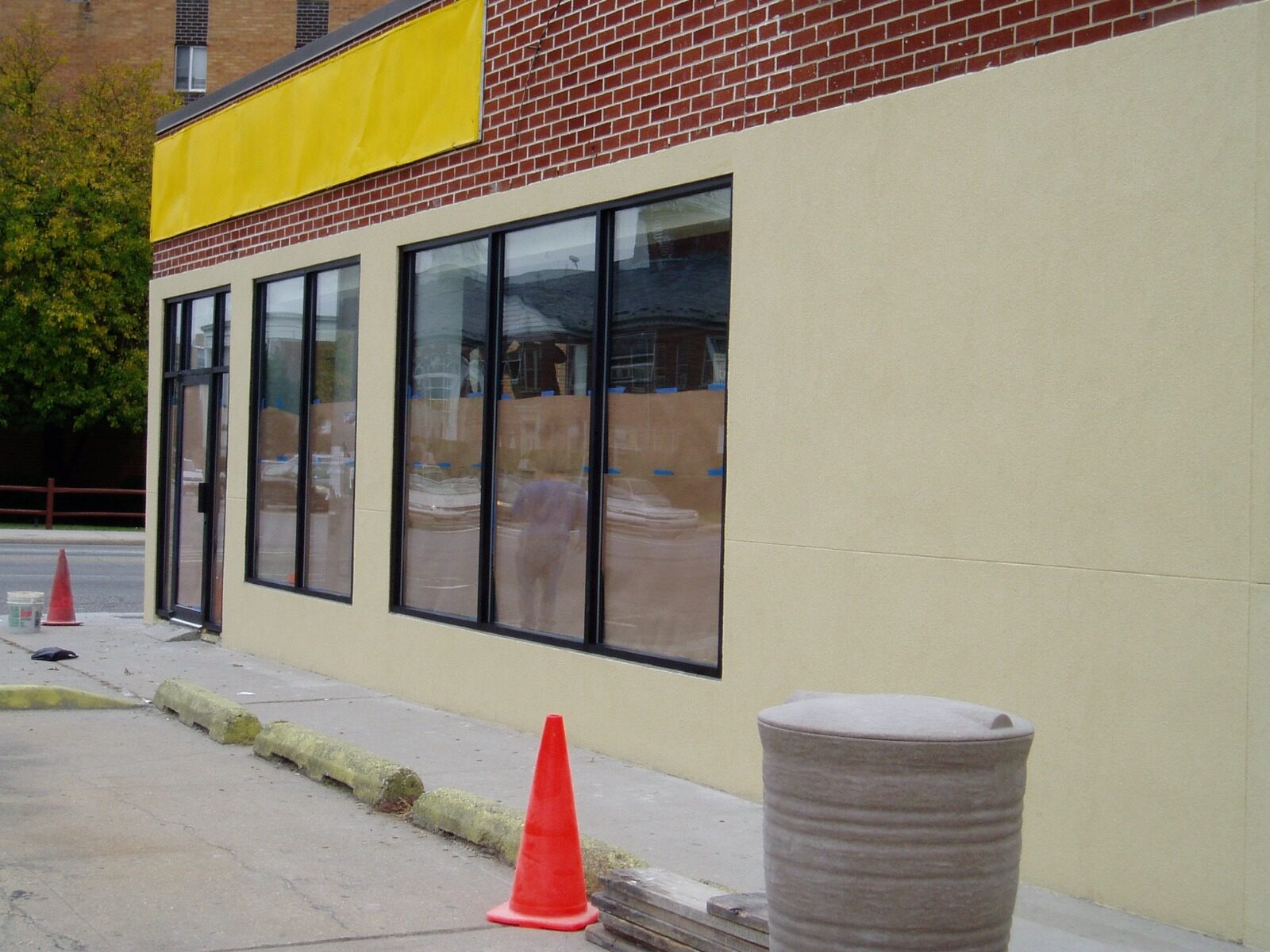 Commercial storefront stucco facade Queens NY