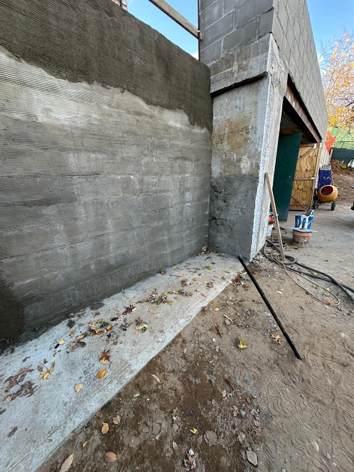 Concrete retaining wall and slab corner - Queens NY