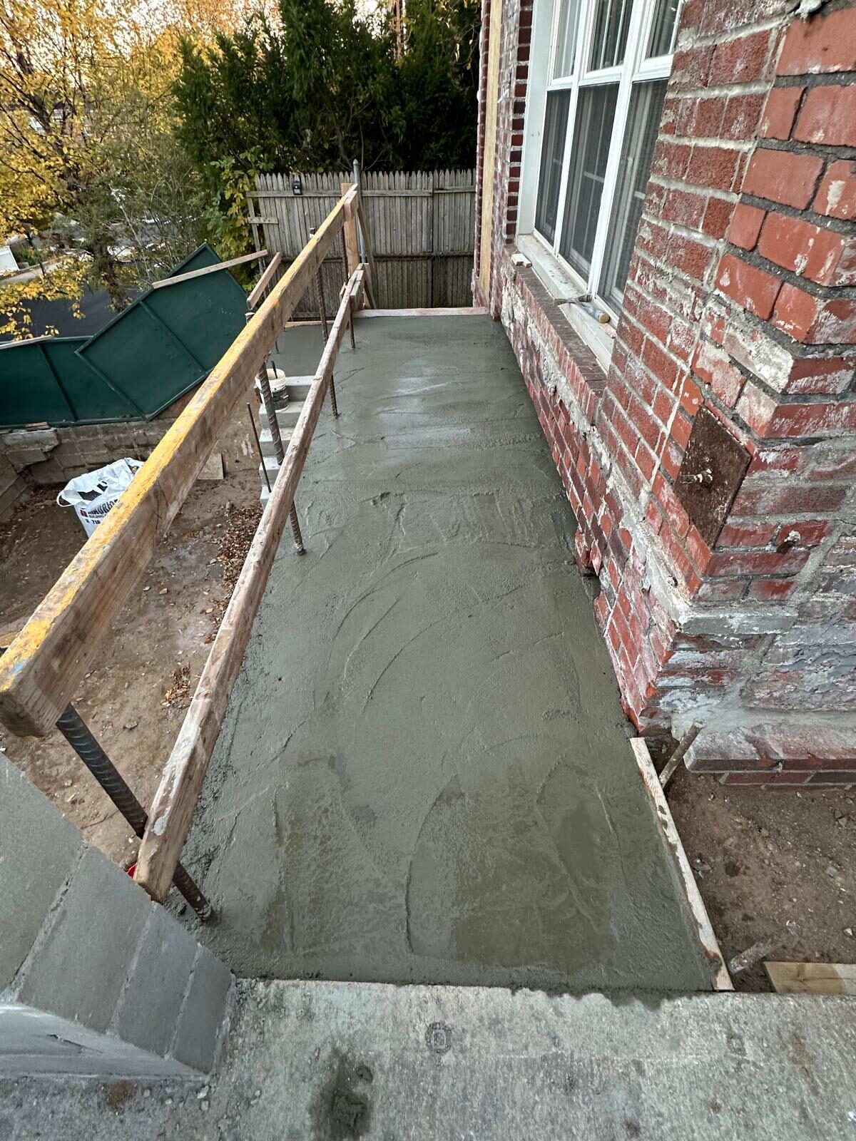Freshly poured concrete patio walkway - Queens NY