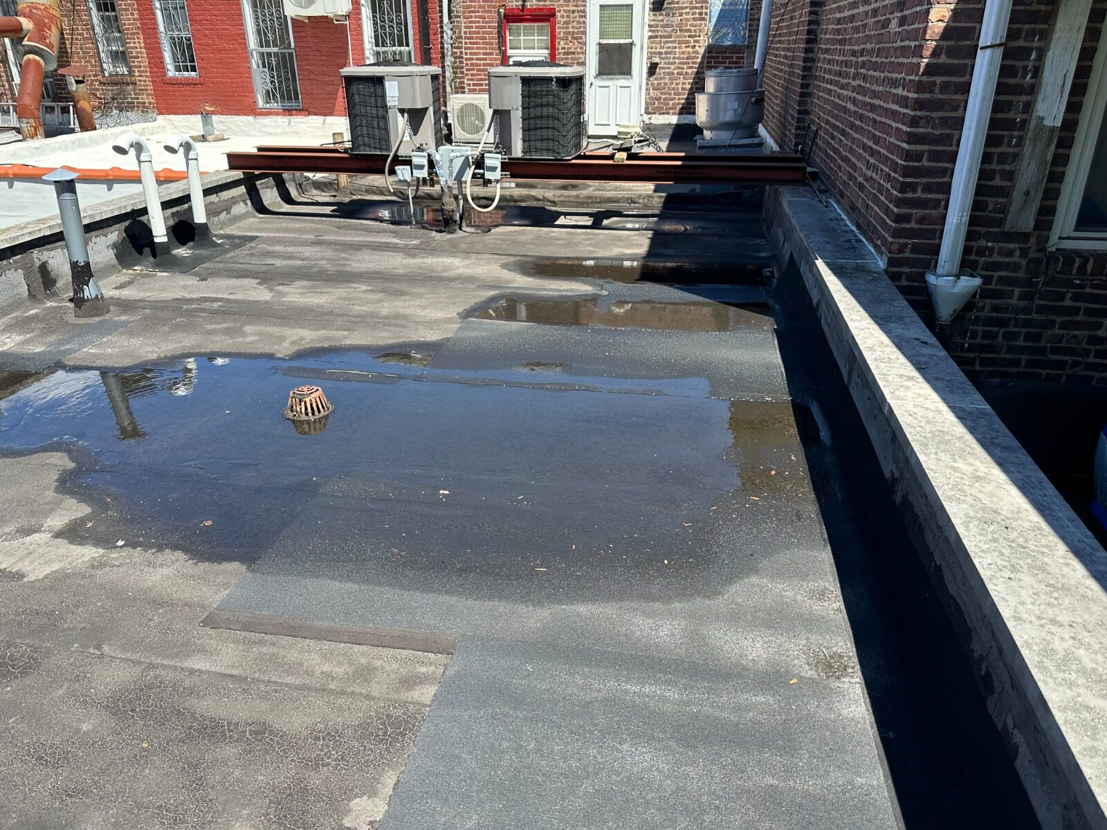 Roof ponding water before repair - Queens NY