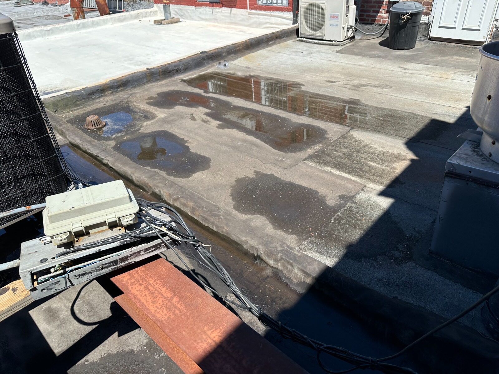 Ponding water and drainage issue on roof - Nassau County